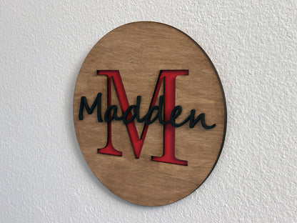 Custom monogram sign with name overlay. Variety of colors and wood stain options to choose from. Makes a great gift for friends, loved ones, teacher appreciation. Approximately 11.75" in diameter. Handmade by Space Rubber Ducky Designs.