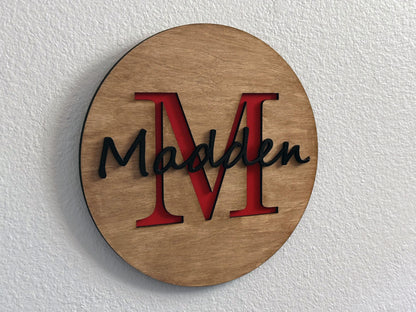 Custom monogram sign with name overlay. Variety of colors and wood stain options to choose from. Makes a great gift for friends, loved ones, teacher appreciation. Approximately 11.75" in diameter. Handmade by Space Rubber Ducky Designs.
