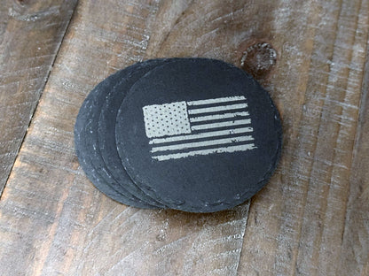 These USA themed slate coasters featured a US Flag design to show off that American pride. Laser engraved with either a light colored flag on a dark background or a dark colored flag on a light background, they’re a bold way to keep your drinks in check. Made from durable slate, these coasters are both functional and stylish, making them a perfect addition to any home or as a patriotic gift.
