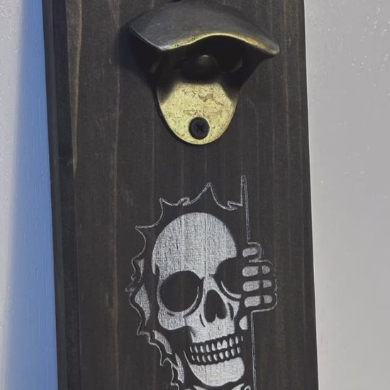 It's spooky season all year long with Mr. Bones peeking around the corner! Each custom magnetic bottle opener is handmade and has hidden rare earth magnets to catch metal bottle caps. Wall-mounted or magnetic backing options. Multiple wood stain choices. Made by Space Rubber Ducky Designs in Southern California, USA.