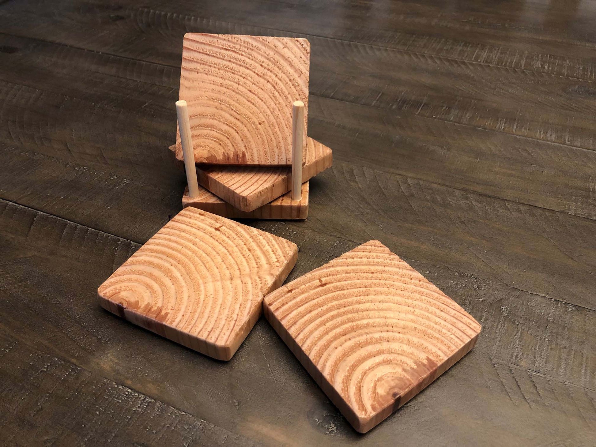 Rustic farmhouse wood coasters. Natural end grain pattern. Charred, burned and distressed. Patriotic red, white and blue distressed and burned.  Set of 4 coasters and holder includes felt food pads. Handmade by Space Rubber Ducky Designs.