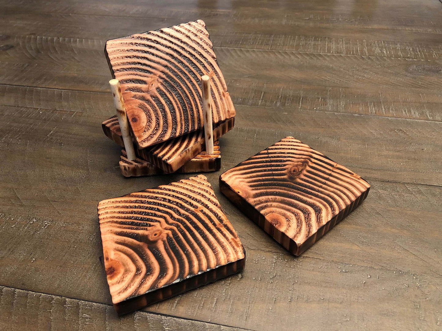 Rustic farmhouse wood coasters. Natural end grain pattern. Charred, burned and distressed. Patriotic red, white and blue distressed and burned.  Set of 4 coasters and holder includes felt food pads. Handmade by Space Rubber Ducky Designs.