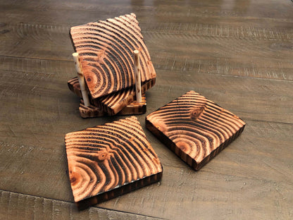 Rustic farmhouse wood coasters. Natural end grain pattern. Charred, burned and distressed. Patriotic red, white and blue distressed and burned.  Set of 4 coasters and holder includes felt food pads. Handmade by Space Rubber Ducky Designs.